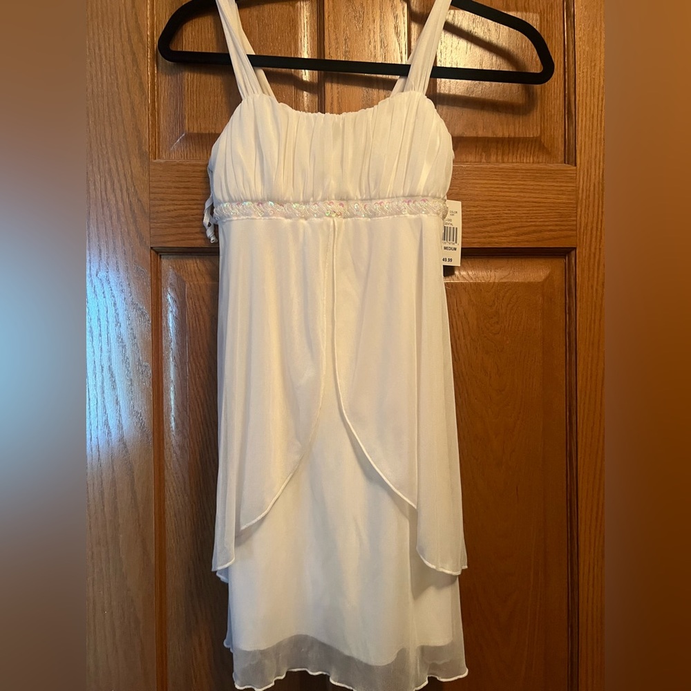 BRAND NEW Girls elegant white dress. Size medium. New with tags.